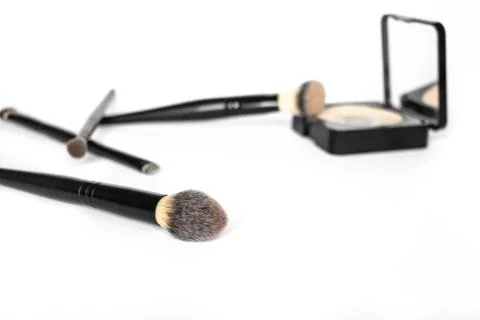 Make up: Half used powder with brushes Stock Photos