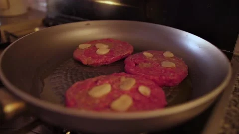 Make a hamburger in the frying pan slow motion Stock Footage 95025708