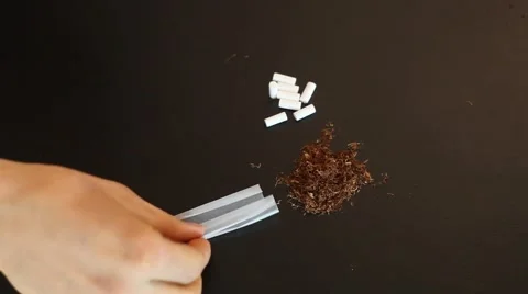 Make hand rolled cigarette Stock Footage 62146418