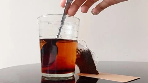 Make an instant teabag into a hot sweet tea Stock Footage 145621570
