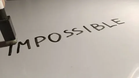 Make it possible, erase im word from impossible. success concept. closeup Stock Footage 233503851