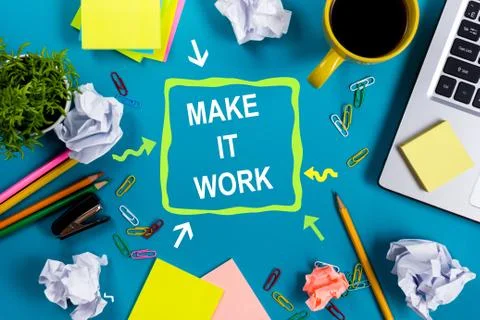 Make it work. Office table desk with supplies, note pad, cup, pen, pc, crumpled Stock Photos