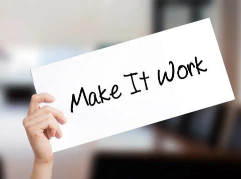 Make It Work Sign on white paper. Man Hand Holding Paper with text. Isolated  Stock Photos
