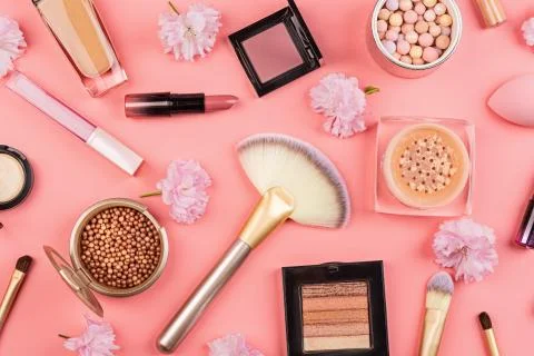 Make up items on pink background. Set of luxury decorative cosmetics flat lay Stock-Fotos