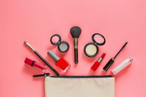Make up items on pink color background. Set of luxury decorative cosmetics fl Stock Photos
