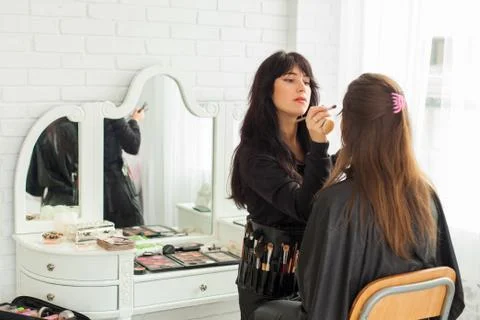 Make-up master doing visage Stock Photos