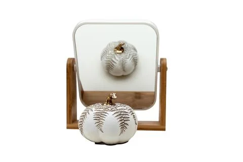 Make-up mirror. Decorative pumpkin. Isolated. Stock Photos