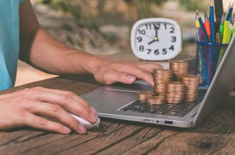 Make money online through a notebook computer. Stock Photos