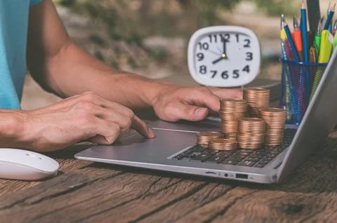 Make money online through a notebook computer. Stock Photos