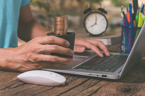 Make money online through a notebook computer. Stock Photos