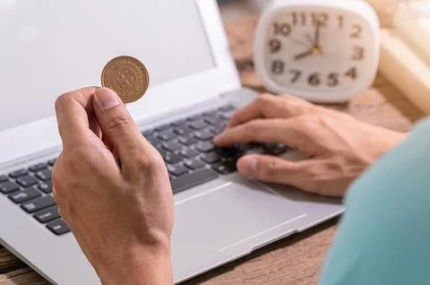 Make money online through a notebook computer. Stock Photos