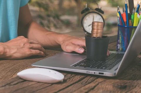 Make money online through a notebook computer. Stock Photos