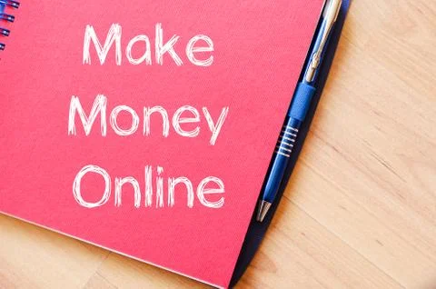 Make money online write on notebook Stock Photos