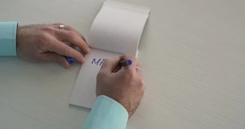 Make Money  - this word is written on the sheet by a man's hand Stock Footage 267083138