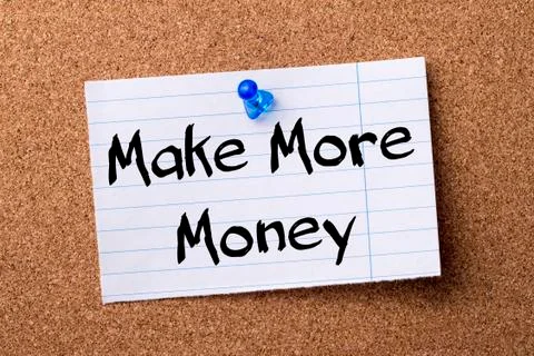 Make More Money - teared note paper  pinned on bulletin board Stock Photos