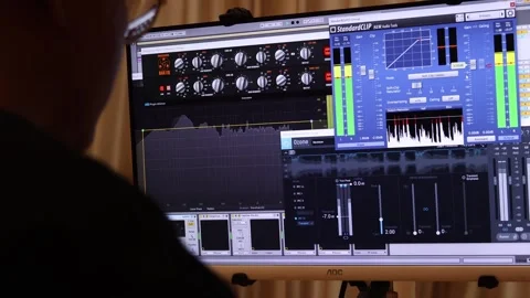 Make music in front of the computer Stock Footage 246779532