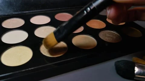 A make up palette and its nude colors, the shot is moving in a half circle Stock Footage 68668810
