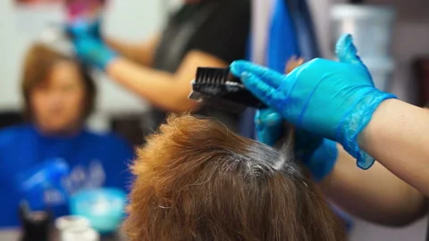 Make partings in the hair Stock Footage 87584212