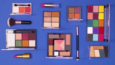 Make up pattern move up and down on dark blue background. Stop motion flat lay Stock-Footage 153174775