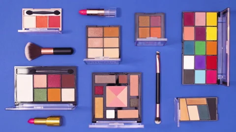 Make up pattern move on dark blue background. Stop motion flat lay Stock Footage 153174250