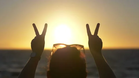 Make peace not war sign at the sunset in 4k slow motion 60fps Stock-Footage 170424670