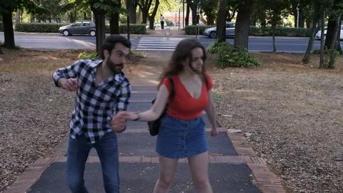 Make peace, reconciliation- young couple discusses then reconciles by kissing Stock Footage 140610326