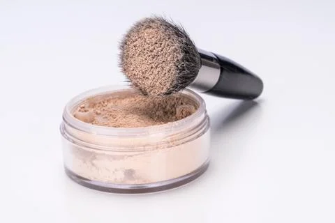 Make-up powder and brush Stock Photos