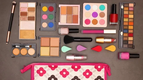 Make up products appear under cosmetics bag for women - Stop motion Stock Footage 123096483