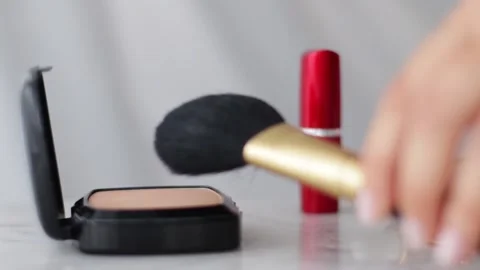 Make-up products on marble table, powder, lipstick and brush as background for Stock Footage 135130792