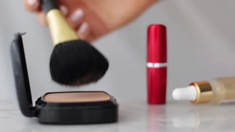 Make-up products on marble table, powder, lipstick and brush as background for Stock Footage 139795337