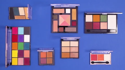 Make up products ordering and make pattern on dark blue background. Stop motion Stock Footage 153174489