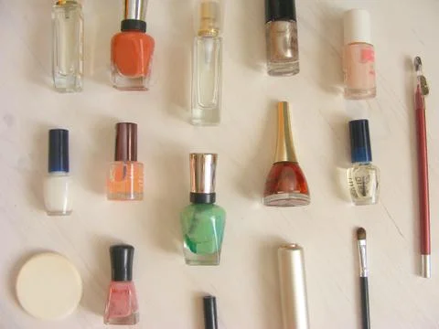 Make up products on shabby table Stock Photos