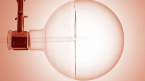 Make-up remover dropper into round flask swirling bubbles form Stock Footage 337113128