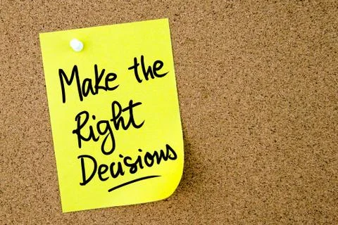 Make The Right Decisions text written on yellow paper note Stock Photos