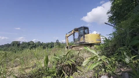 Make a road using an excavator Stock Footage 312390371