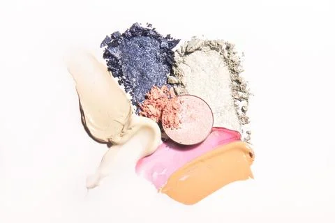 Make up samples of eye shadow, foundation, lip gloss and blush. Stock Photos
