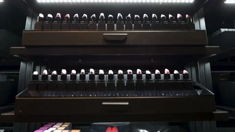 Make up shelf with lots of lipstick Vídeo Stock 134663760