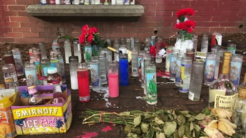 A Make Shift Memorial Shrine in a Schoolyard for Teenager That Died. Stock Footage 169331386