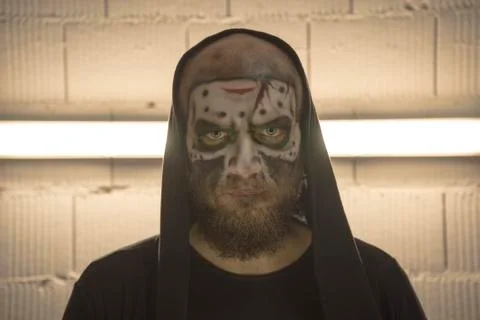 Make up the skull. A bald guy with a beard with a makeup skull. A man with a  Stock Photos