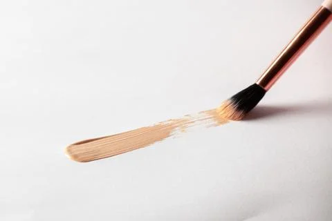 Make up smear foundation smudge drawing by cosmetic brush texture. Liquid Stock Photos