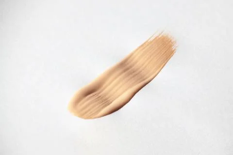 Make up smear foundation smudge texture. Liquid foundation swatch close up Stock Photos