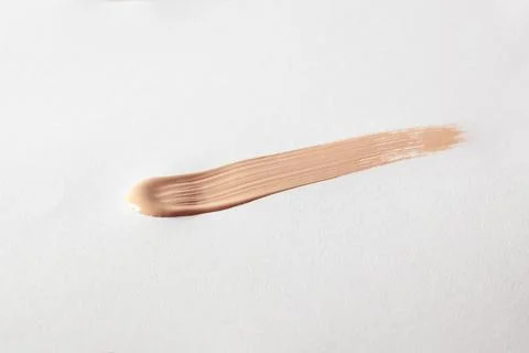 Make up smear foundation smudge texture. Liquid foundation swatch close up Stock Photos