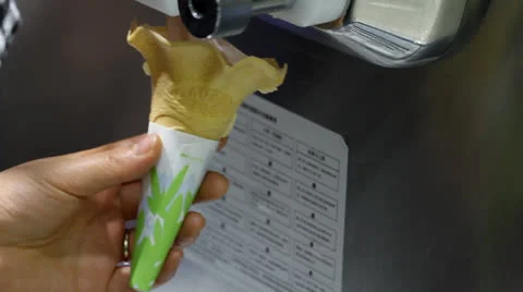 Make soft ice-cream on a cone Stock Footage 24899073