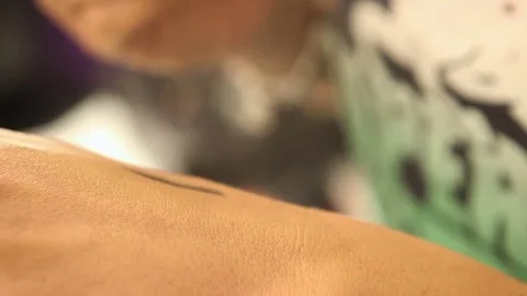 Make up stylist trying out different eye pencils on her hand Stock Footage 81309195