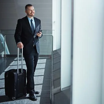 Make sure you answer when success calls. an executive businessman walking Stock Photos
