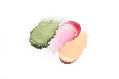 Make up swatches for lip gloss, foundation and eye shadow. Stock Photos