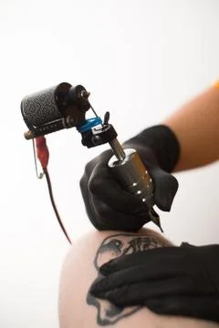 Make a tattoo on the leg sketch machine Stock Photos