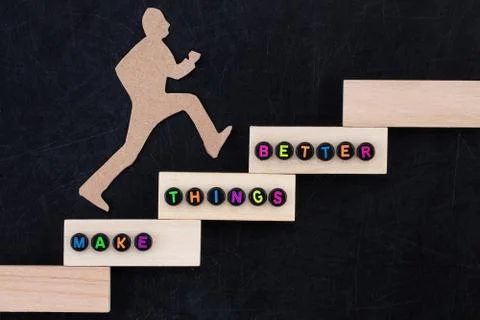 Make things better - Improvement Concept. paper man climbing the steps to suc Stock Photos