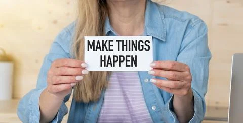 Make things happen, text words typography written on book against wooden ba.. Foto stock