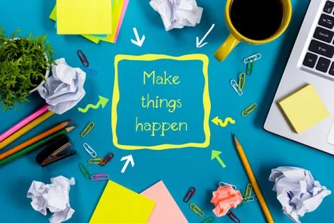 Make things happens. Office table desk with supplies, white blank note pad, cup Stock Photos